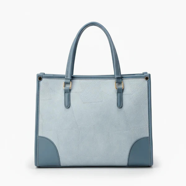 Front view of the Anelisse vegan leather tote bag in blue, with a modern geometric pattern and elegant detailing