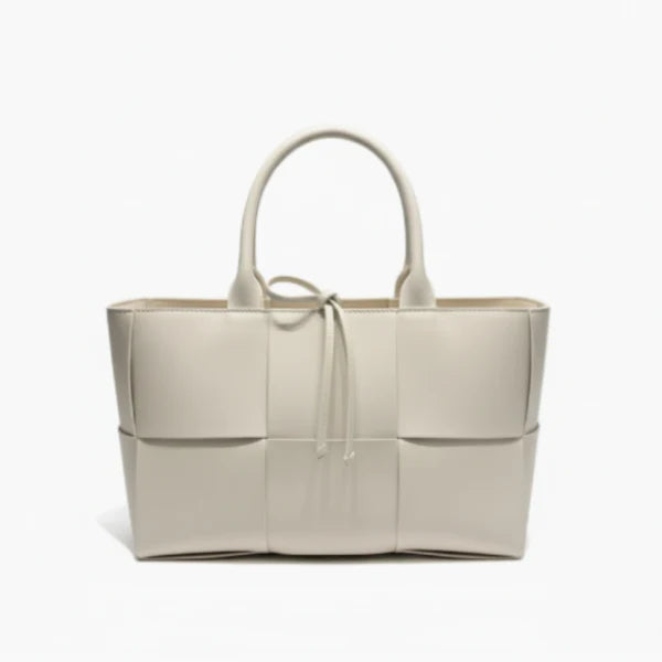 Front view of Aurelia off-white genuine leather tote bag with woven texture, leather handles, and tie closure