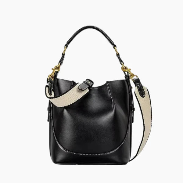 Calypso Vegan Leather Crossbody Bag in black, front studio view showcasing structured bucket silhouette, top handle, and detachable shoulder strap