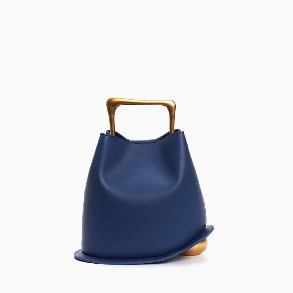 Front view of a Blue Izelia top grain leather crossbody bag with a gold handle on a white background