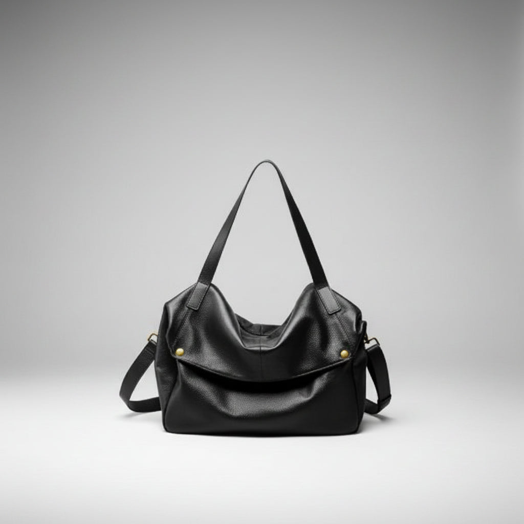 Lunara genuine leather shoulder bag in black front view highlighting the spacious design with gold accents