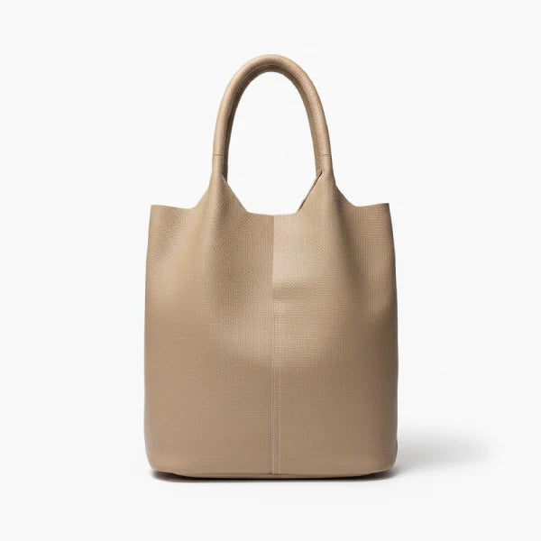 Front view of khaki cowhide leather tote bag with minimalist design, featuring a structured shape and durable handles for everyday use