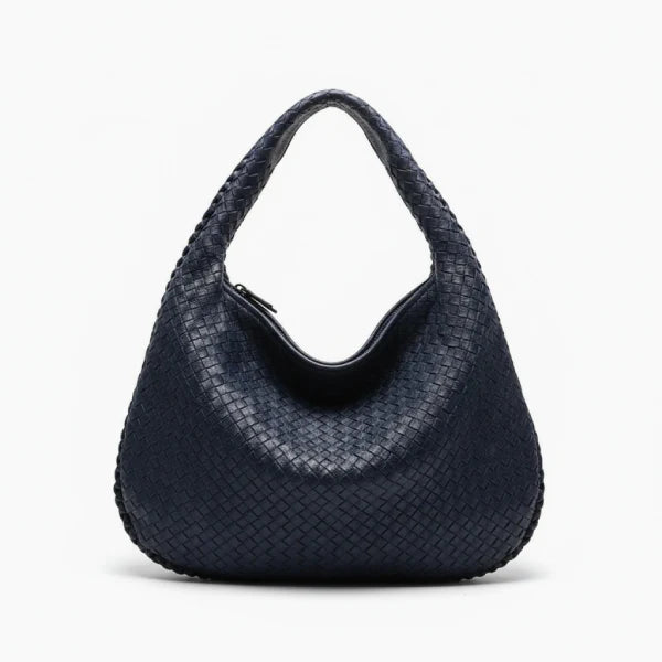 Front view of dark blue woven vegan leather hobo bag with a structured design, wide handle, and zipper opening