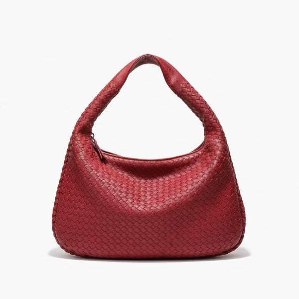 Front view of red woven vegan leather hobo bag with wide handle, zipper opening, and smooth texture