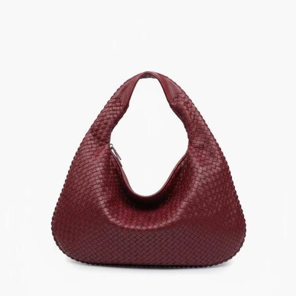 Front view of wine red woven vegan leather hobo bag with wide handle, zipper opening, and detailed texture