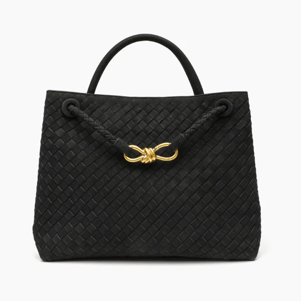 Front view of the Veyra vegan leather tote bag in black, featuring a woven texture and gold-tone knot closure for a sophisticated touch