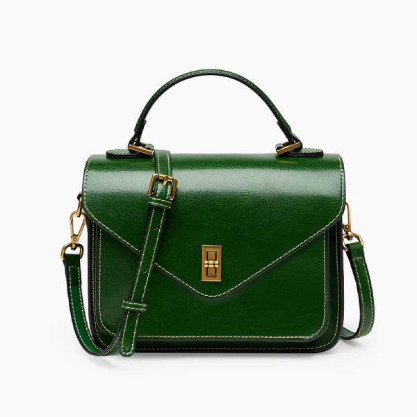 Front view of the green genuine leather satchel bag with gold-tone hardware, offering a structured and elegant design perfect for any occasion