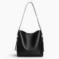 Amara Vegan Leather Bucket Bag in black, front studio view highlighting clean bucket silhouette and long shoulder strap