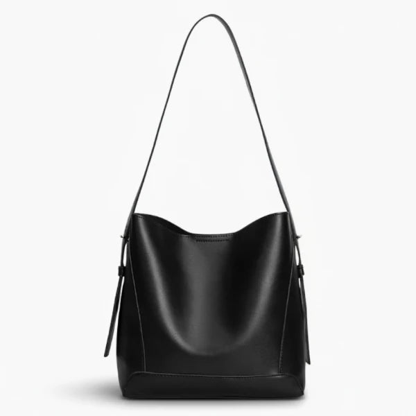 Amara Vegan Leather Bucket Bag in black, front studio view highlighting clean bucket silhouette and long shoulder strap