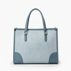 Front view of the Anelisse vegan leather tote bag in blue, with a modern geometric pattern and elegant detailing