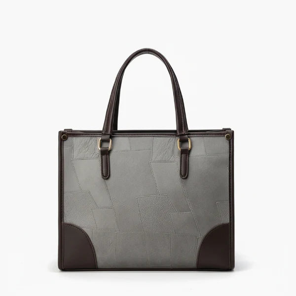 Front view of the Anelisse vegan leather tote bag in grey, with sleek design and elegant brown leather corners