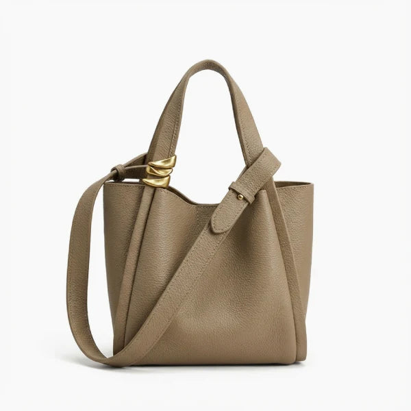 Arden Genuine Leather Bucket Bag in beige, front studio view highlighting compact bucket silhouette, dual top handles, and crossbody strap