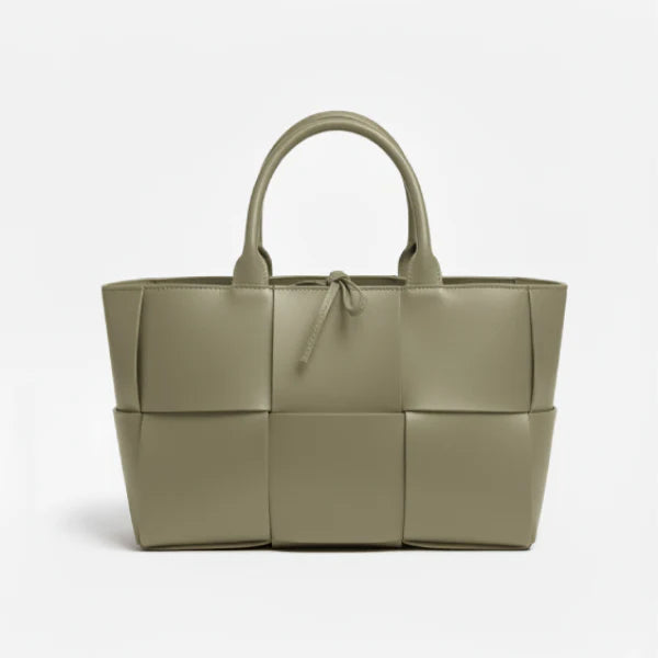 Front view of Aurelia green genuine leather tote bag with woven texture, leather handles, and tie closure