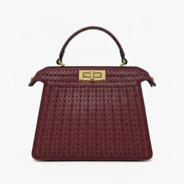 Front view of Aurora vegan leather satchel bag in wine red with woven texture and gold clasp