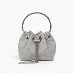Aveline Rhinestone Crystal Evening Bag in silver, front studio view with circular metal handle and sparkling crystal exterior