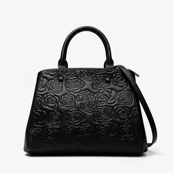 Front view of Azura genuine leather black satchel bag with embossed rose design and gold hardware