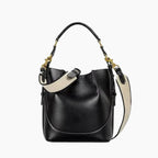 Calypso Vegan Leather Crossbody Bag in black, front studio view showcasing structured bucket silhouette, top handle, and detachable shoulder strap