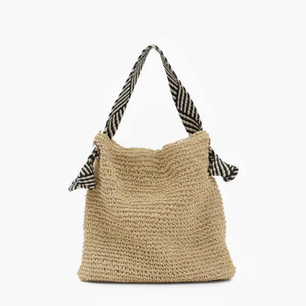 Front view of beige woven tote bag with striped black and white handles, perfect for casual summer use