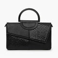 Front view of a black vegan leather satchel bag with a unique croc-embossed and smooth leather design, showcasing its structured shape and top handle