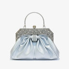 Front view of a blue vegan leather evening bag featuring a rhinestone-studded gold frame, pleated design, and elegant clasp