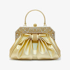 Front view of a gold vegan leather evening bag with intricate rhinestone-studded frame and elegant pleated design