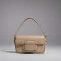 Faelina genuine cowhide shoulder bag in apricot front view with minimalistic buckle design and smooth leather finish
