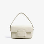 Faelina genuine cowhide shoulder bag in off-white front view with minimalistic design and distinctive buckle feature