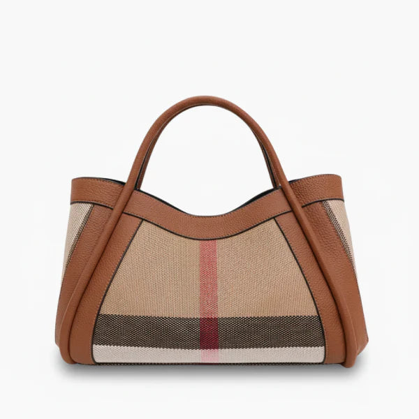 Front view of a brown canvas and leather tote bag with dual leather handles and a sleek design