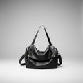Lunara genuine leather shoulder bag in black front view highlighting the spacious design with gold accents