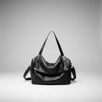 Lunara genuine leather shoulder bag in black front view highlighting the spacious design with gold accents