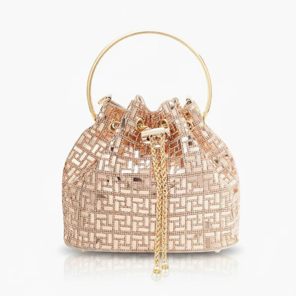 Lyanna Metallic Embellished Bucket Bag in gold, front studio view showcasing round top handle, shimmering pattern, and chain tassel detail