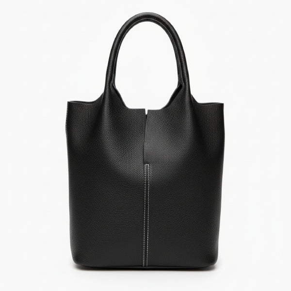 Front view of black cowhide leather tote bag with sleek, structured design and white stitching detail for a modern look