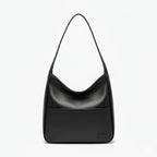 Front view of Seliora vegan leather shoulder bag in black with sleek design and front pocket
