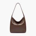 Front view of Seliora vegan leather shoulder bag in coffee color with minimalist design and front pocket