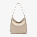 Front view of Seliora vegan leather shoulder bag in off-white color with sleek design and front pocket