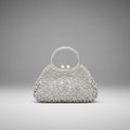 Front view of serenna rhinestone evening bag in silver with detailed rhinestone embellishments and pearl clasp