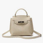 Front view of the off-white genuine leather satchel bag with silver hardware, offering a sleek and sophisticated design perfect for daily use