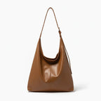 Sorella Vegan Leather Hobo Bag in brown, front view of sleek minimalist hobo with adjustable shoulder strap
