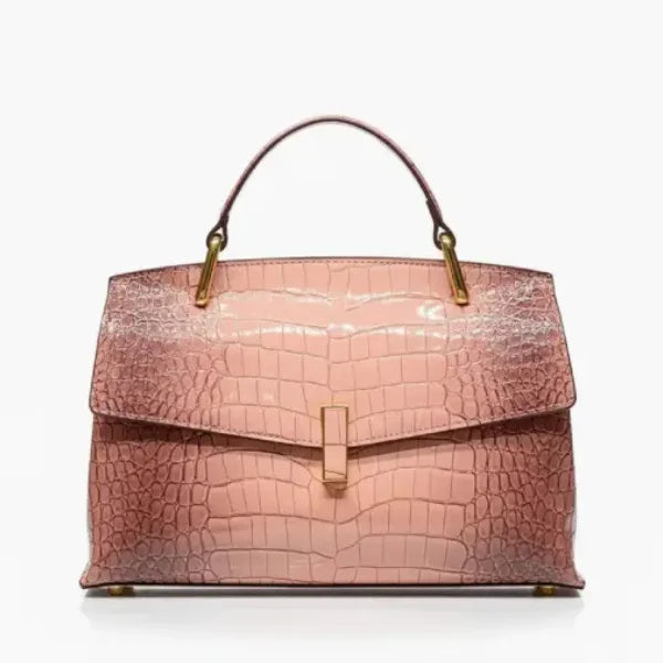  Front view of pink crocodile leather satchel bag featuring a gold clasp and glossy textured finish