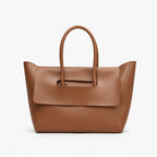 Front view of Sylvene vegan leather tote bag in a rich caramel color, showcasing its sleek and modern design