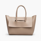 Front view of the Sylvene vegan leather tote bag in khaki color, showcasing its elegant and modern style with a simple flap design