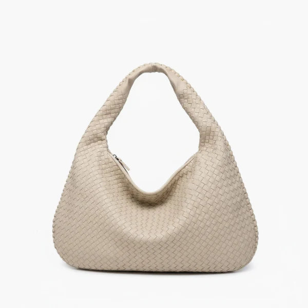 Front view of off-white woven vegan leather hobo bag with wide handle and zipper opening