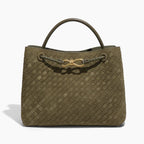 Front view of the Veyra vegan leather tote bag in green, showcasing the sophisticated woven texture and luxurious gold-tone knot accent