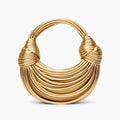Zyra Vegan Leather Evening Bag in gold, front studio view showcasing crescent silhouette with layered cord texture